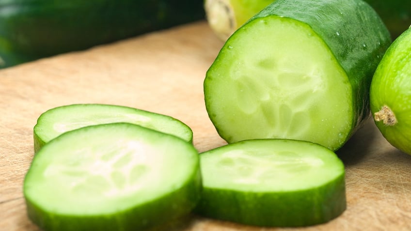 Sliced Cucumbers on Cutting Board