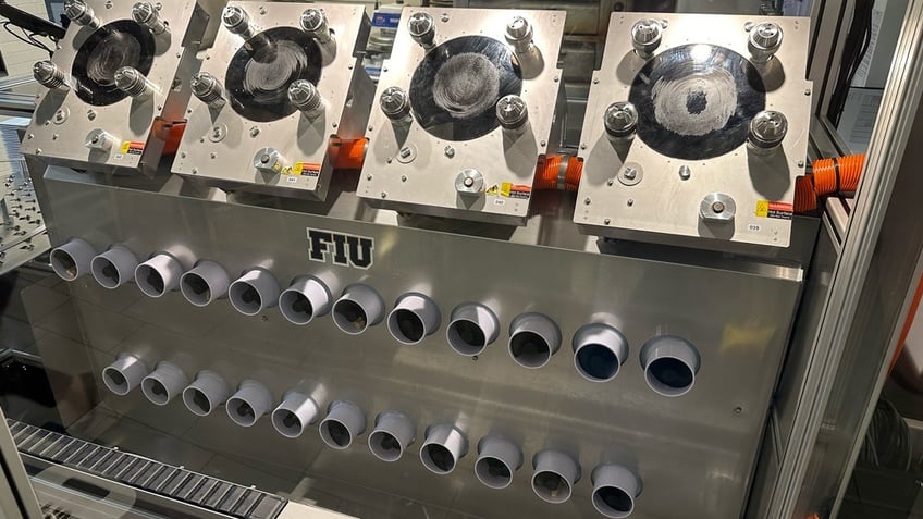 FIU's Beastro has four induction plates and two rows of feeders that it uses to make multiple meals at a time.