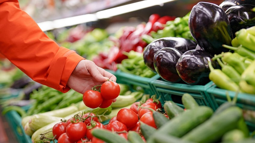 Hand reaching out for produce