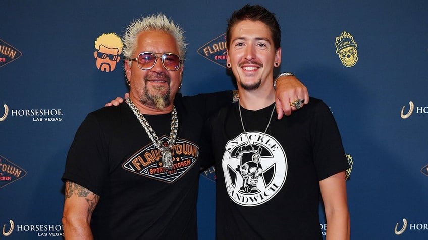 Guy Fieri and son Hunter walk red carper