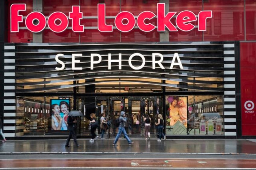 foot locker lowers full year outlook again pauses dividend as 2q sales fall on cautious consumers