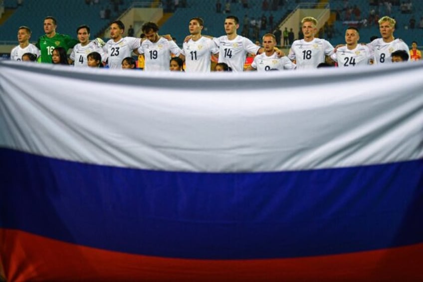 Russia's players stand for the national anthem in Hanoi