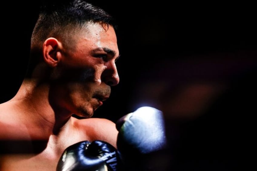 Mexico's Luis Alberto Lopez, shown in a prior title defense, beat Japan's Reiya to retain