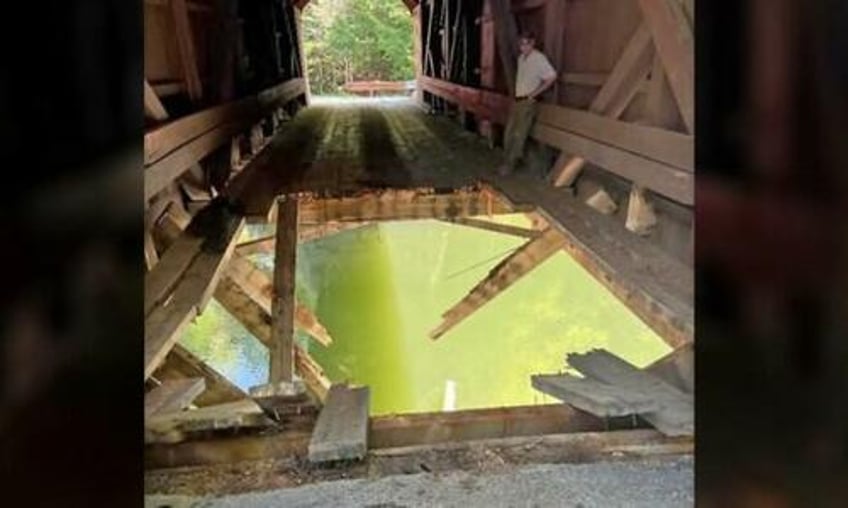 ford f 750 plunges through historic wooden bridge in maine