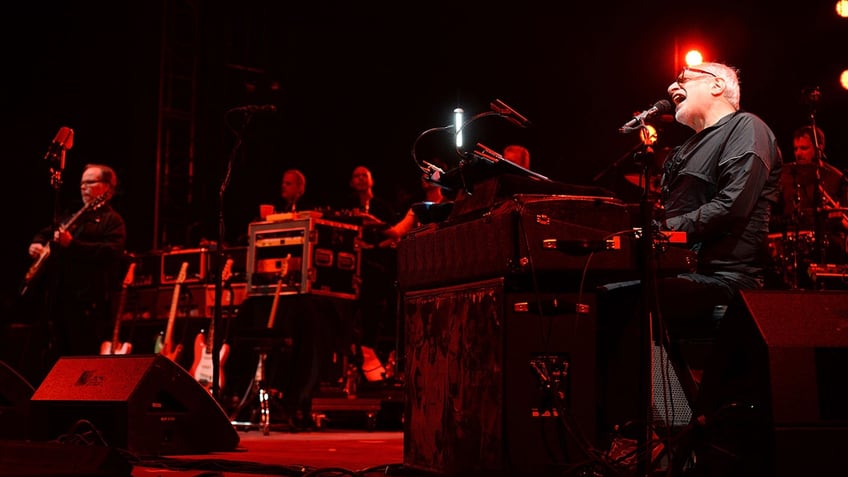 Guitarist Walter Becker and singer Donald Fagen of Steely Dan perform on stage