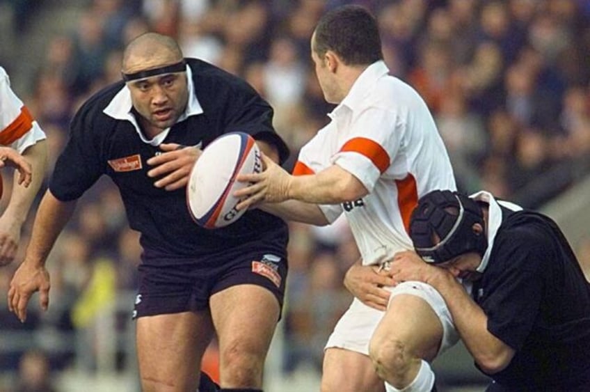 Norm Hewitt, left, who has died aged 55, playing against England in 1997