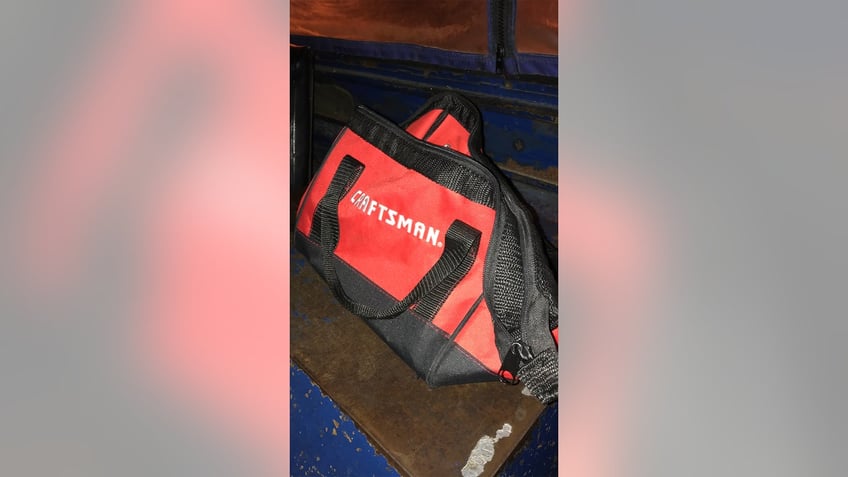 A red and black Craftsman brand tool bag