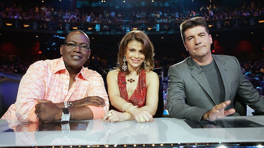 Randy Jackson, Paula Abdul, and Simon Cowell at the "American Idol" judges table.