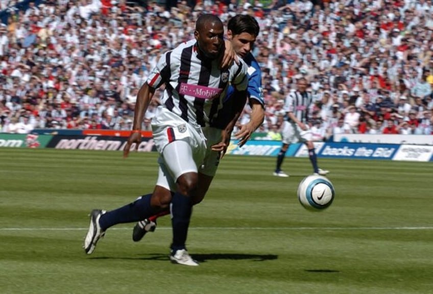 Kevin Campbell (L), playing for West Brom, attempts to get past Portsmouth defender Dejan