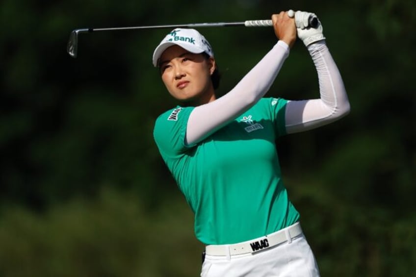 Minjee Lee of Australia plays a tee shot on the way to a share of the third-round lead in