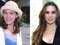 Former Disney star 'never regretted' getting breast implants as a teen after being encouraged by mom