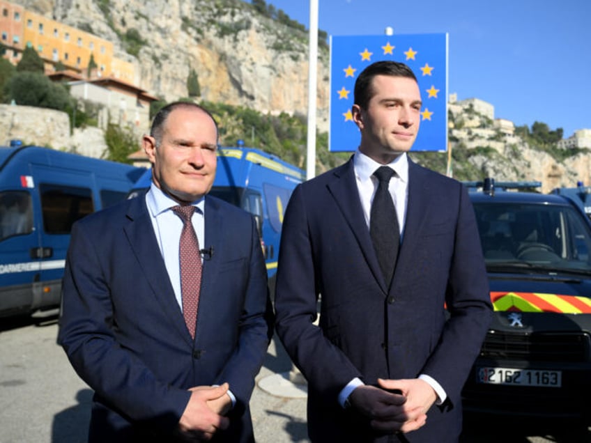 French far-right Rassemblement National (RN) party President Jordan Bardella (R) and RN pa