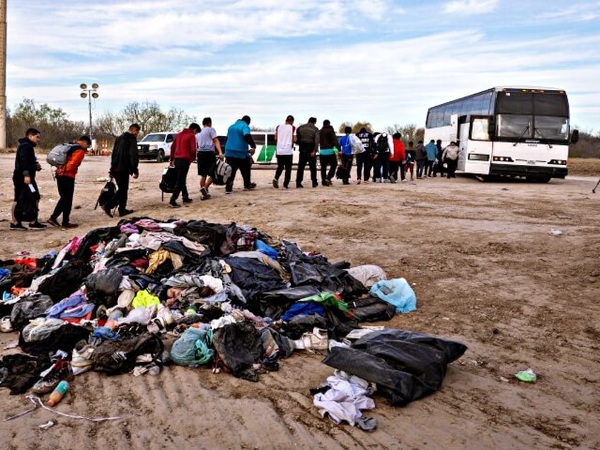 EAGLE PASS, TEXAS - JANUARY 07: Immigrants file into a U.S. Customs and Border Protection bus after crossing the U.S.-Mexico border on January 07, 2024 in Eagle Pass, Texas. According the a new report released by U.S. Department of Homeland Security, some 2.3 million migrants, mostly from families seeking asylum, …