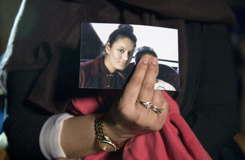 A teenage Shamima Begum, seen in a photo held by her eldest sister Renu