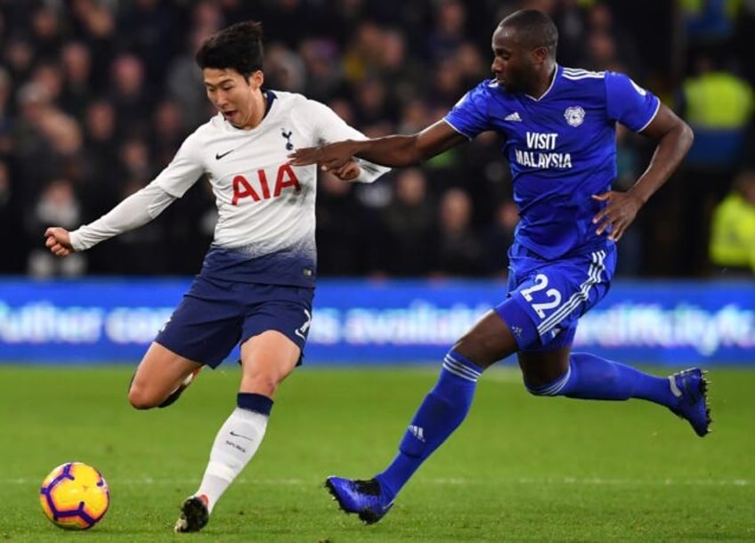 Sol Bamba (R) playing for Cardiff closes in on Tottenham Hotspur's South Korean striker So