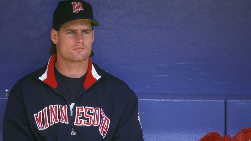 Scott Erickson looks on before a game