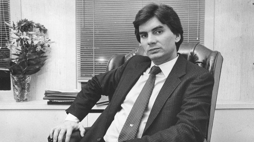 Michael Franzese in a suit and tie sitting down