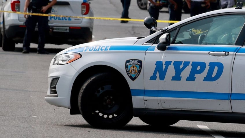 An NYPD police vehicle at the scene of an accident