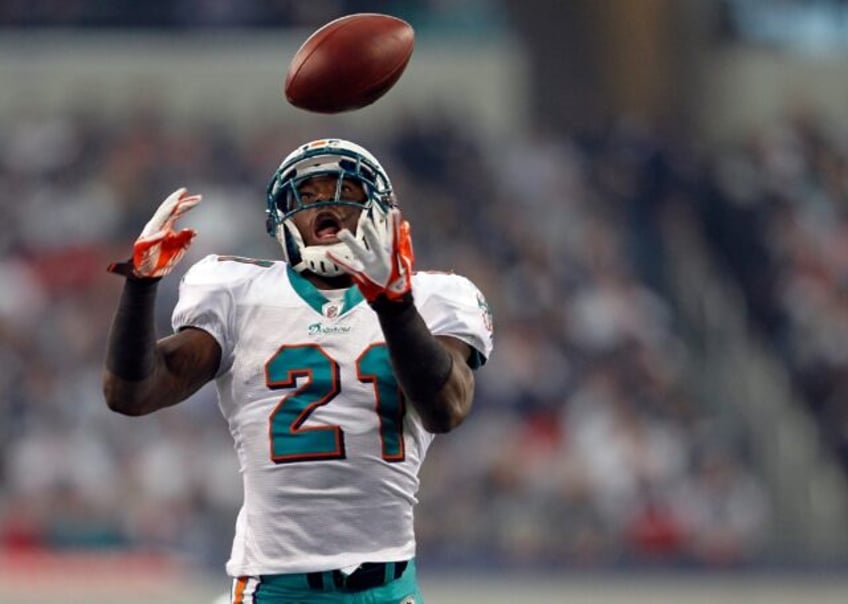 Vontae Davis makes an interception for Miami during the 2011 Thanksgiving game against the