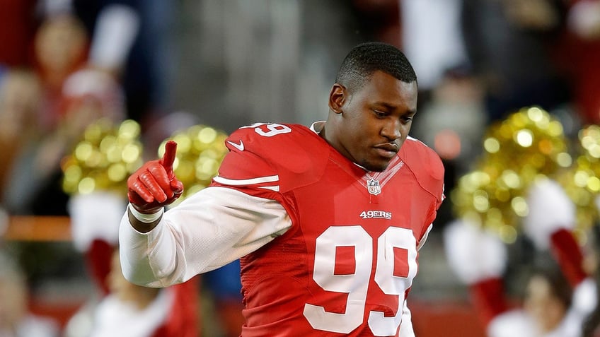 Aldon Smith runs on field