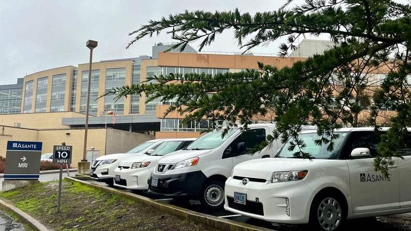 White cars sit in the parking lot outside of the Asante Rogue Regional Medical Center in Medford, Oregon.