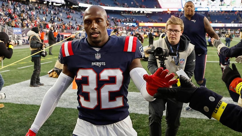 Devin McCourty high fiving fans