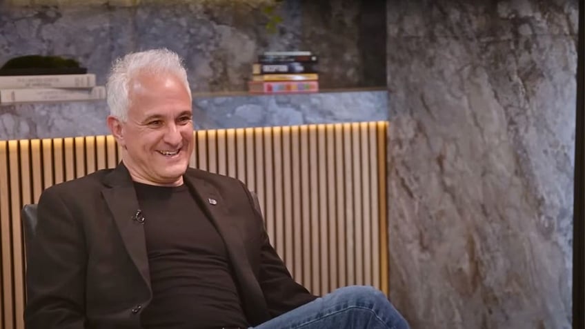 Photo of Peter Boghossian, man sitting on chair smiling