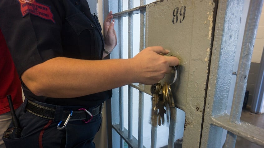 Prison guard at a jail cell