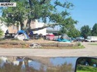 Former school campus becomes tent city as Mississippi neighborhood's homeless population reaches crisis point