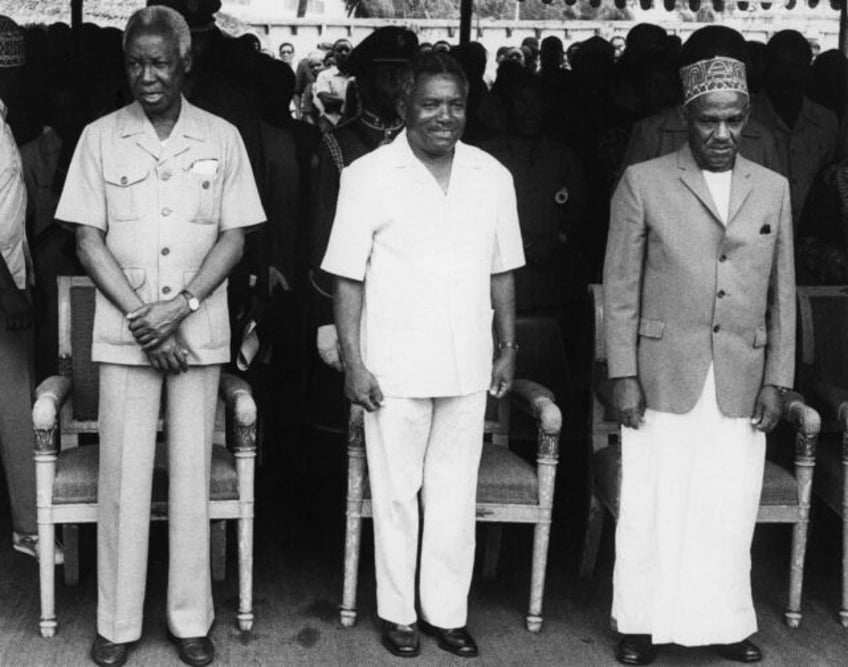 Hand-picked by independence hero Julius Nyerere (L) to succeed him, Mwinyi (C) inherited a