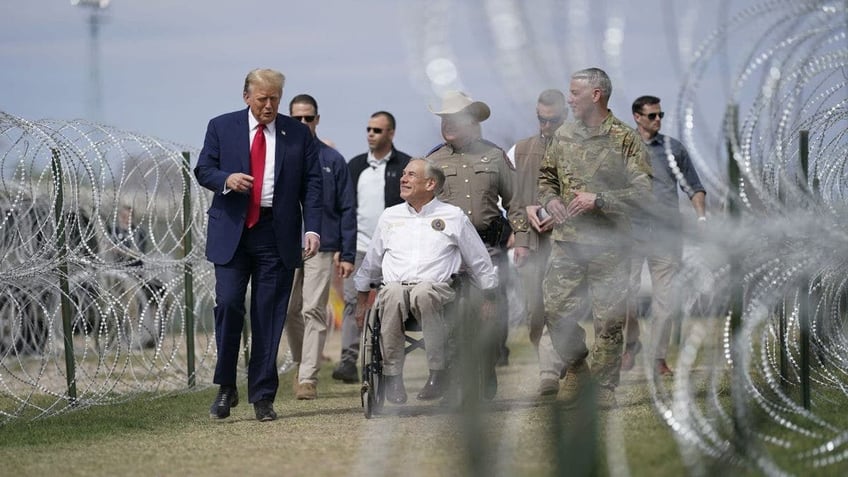 Greg Abbott, center, with former President Trump in Feb. 2024 at Eagle Pass, Texas