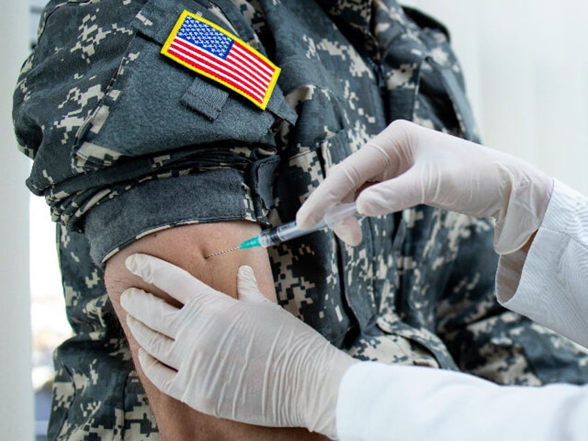 former troops punished over bidens vaccine mandate sue for billions in lost wages