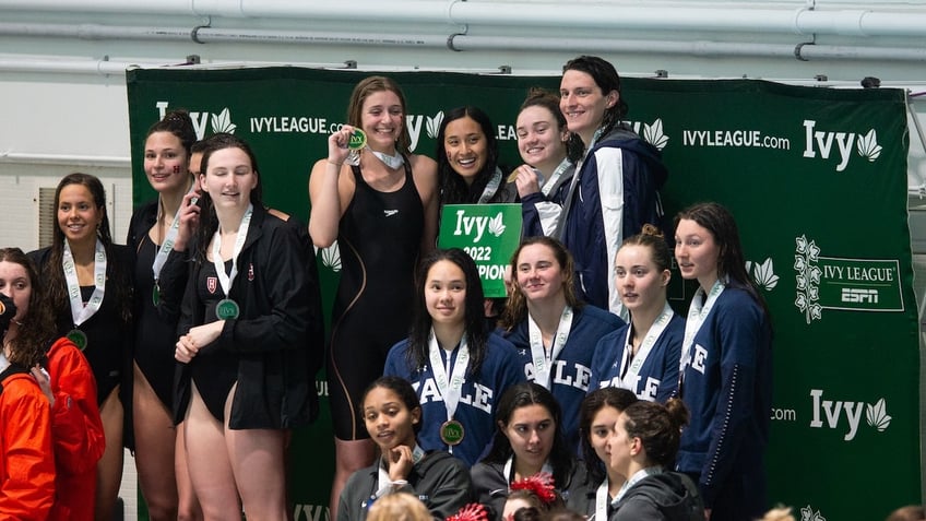 University of Pennsylvania swimmer Lia Thomas poses with her teammates Hannah Kannan, Camryn Carter, and Margot Kaczorowski after winning the 400 yard freestyle relay during the 2022 Ivy League Womens Swimming and Diving Championships at Blodgett Pool on February 19, 2022 in Cambridge, Massachusetts. 