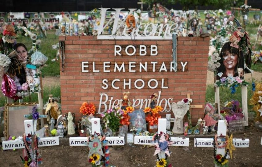 Crosses honor those who lost their lives during the Robb Elementary School shooting in Uva