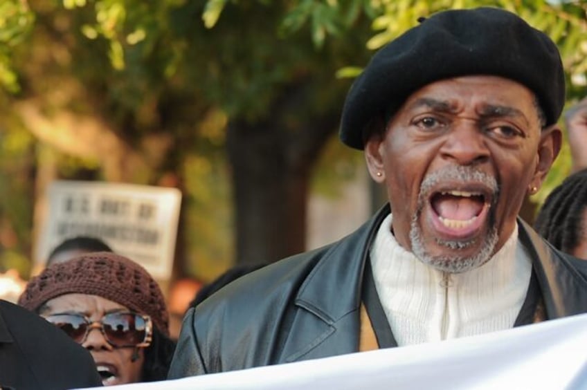 Activist Omali Yeshitela, seen at a White House protest in November 2009, has been charged