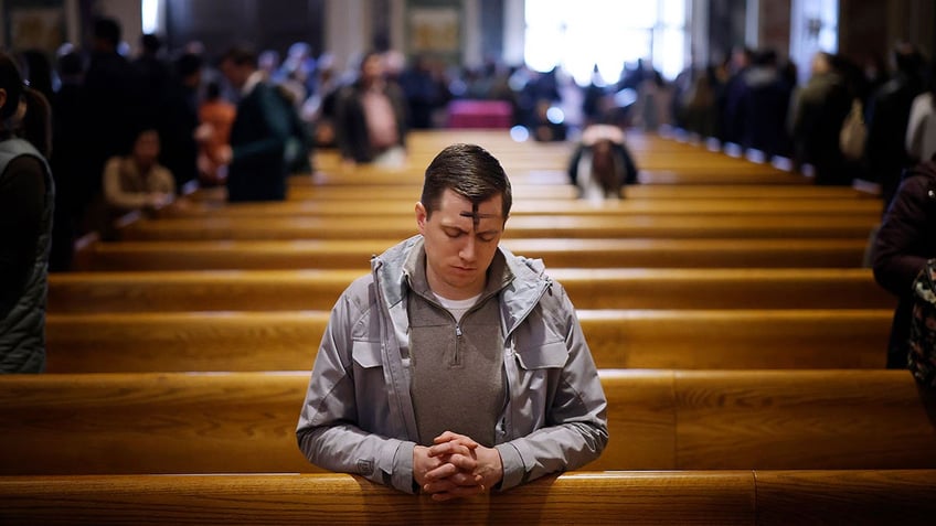 Man praying on Ash Wednesday