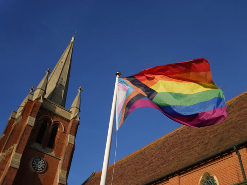 A rainbow flag, a symbol of lesbian, gay, bisexual, transgender, and queer (LGBT) pride and LGBT social movements, flies at St John the Baptist church in Felixstowe, Suffolk, after the use of prayers of blessing for same-sex couples in Church of England services were approved by the House of Bishops. …