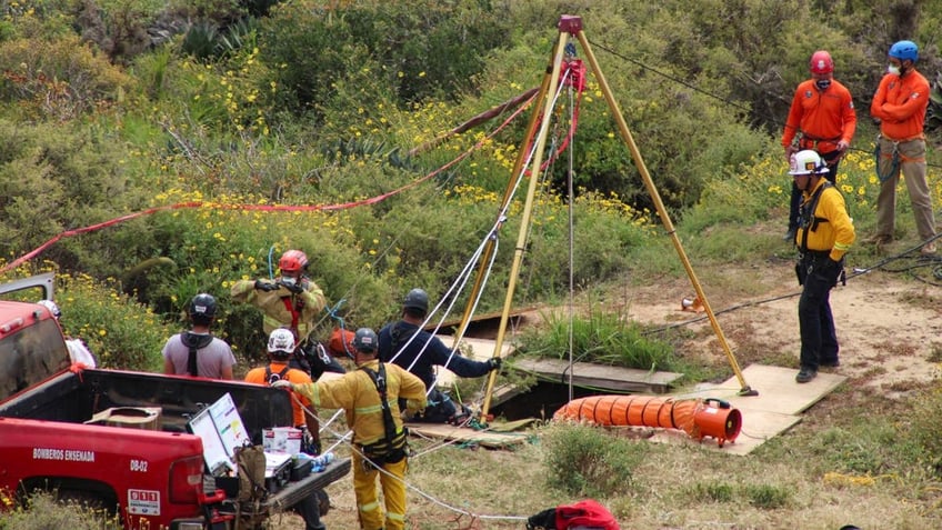 Rescue team workers search for missing tourists in Mexico