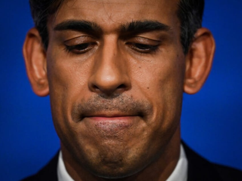 LONDON, ENGLAND - SEPTEMBER 20: UK Prime Minister Rishi Sunak reacts while a holding press