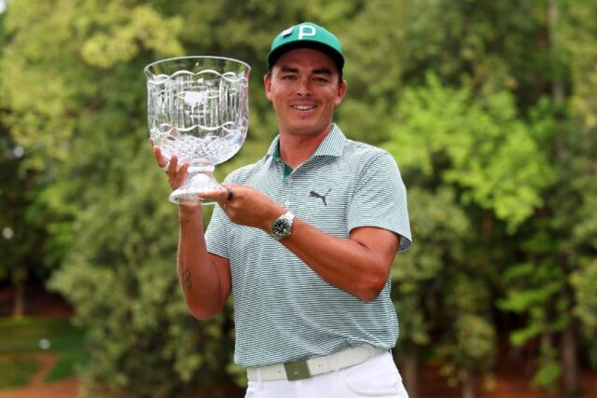 Rickie Fowler holds the Masters Par-3 Contest champion's crystal bowl, a prize no golfer h