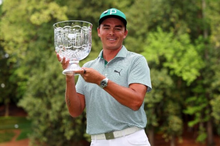 Rickie Fowler holds the Masters Par-3 Contest champion's crystal bowl, a prize no golfer h