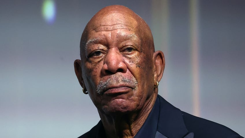 Morgan Freeman looks serious staring directly at the camera in Monaco