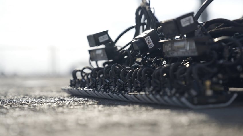 Close-up of a Gecko Robotics unit as it crawls across a Carrier deck.