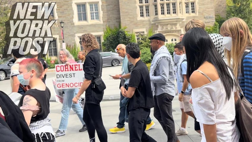 Russell Rickford, an associate professor of history at Cornell University who cheered the oct. 7 Hamas attacks, is seen on video with a keffiyeh around his shoulders marching with dozens of anti-Israel supporters on campus.