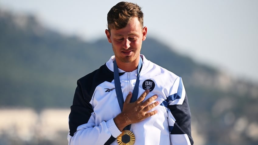 Tom Reuveny of Team Israel celebrates winning the Gold medal