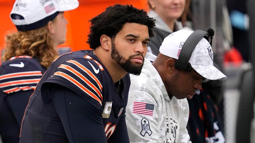 Caleb Williams sits on bench