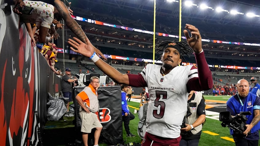 Jayden Daniels celebrating