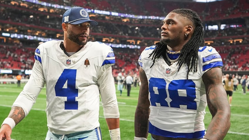 Dak Prescott and CeeDee Lamb walk off field