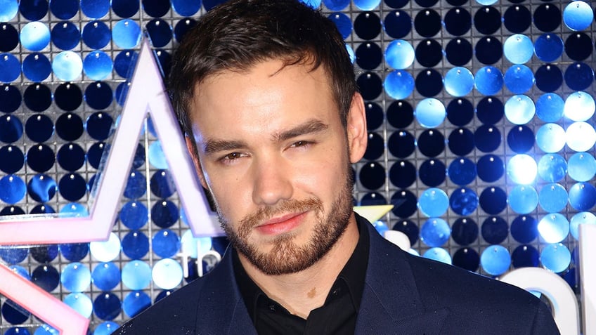 Liam Payne poses for photographers upon arrival at the Global Gift Gala