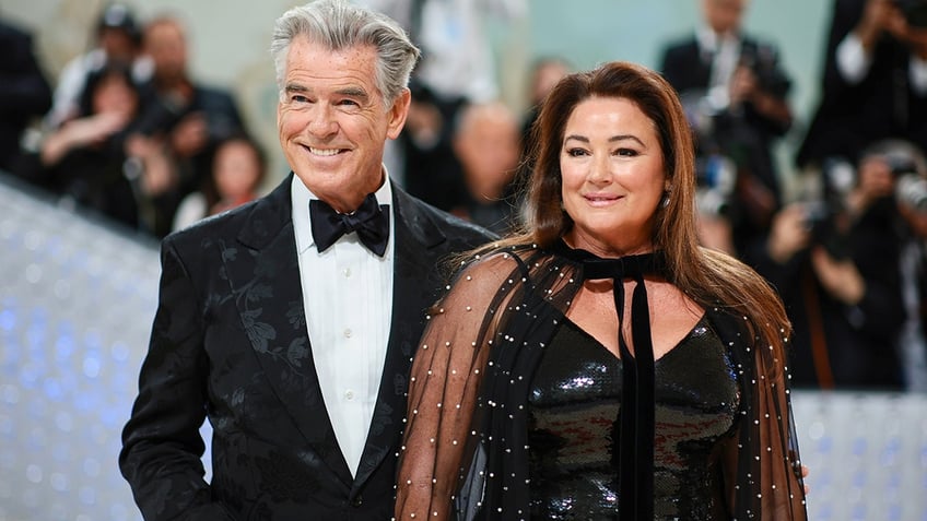 Pierce Brosnan smiles alongside wife Keely who wore black latex to Met Gala